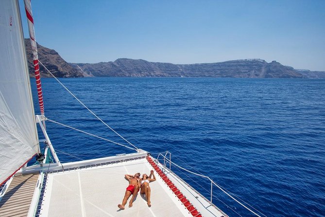 Sailing Catamaran Cruise in Santorini with BBQ, Drinks and Transfer - Red Beach swim and snorkel: short stop, big water payoff