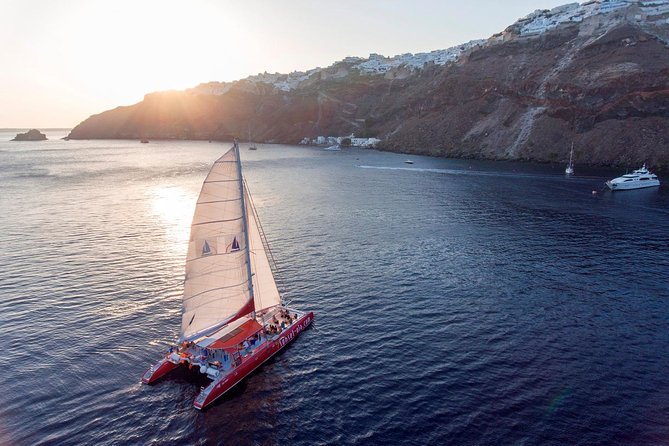 Sailing Catamaran Cruise in Santorini with BBQ, Drinks and Transfer - White Beach BBQ lunch: the best mix of food, swim time, and shade