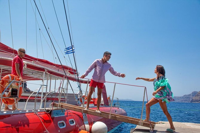 Sailing Catamaran Cruise in Santorini with BBQ, Drinks and Transfer - Drinks, music, and the comfort details that make the day easier