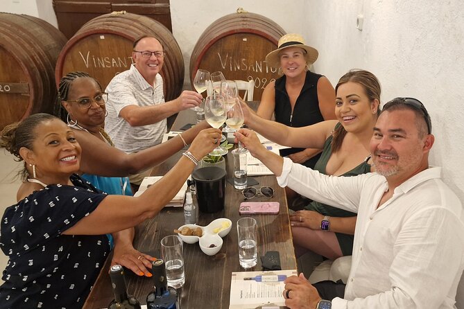 Santorini: 4hrs Small Group Wine Tasting Tour with Local Bites - Artemis Karamolegos Winery: Scenic Setting, Award-Winning Pouring