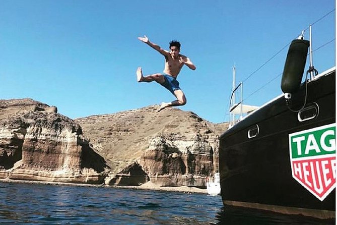 Santorini Adventurous Catamaran Experience with Snorkeling - Red Beach: Color From Iron Soil and a Quick Photo Stop