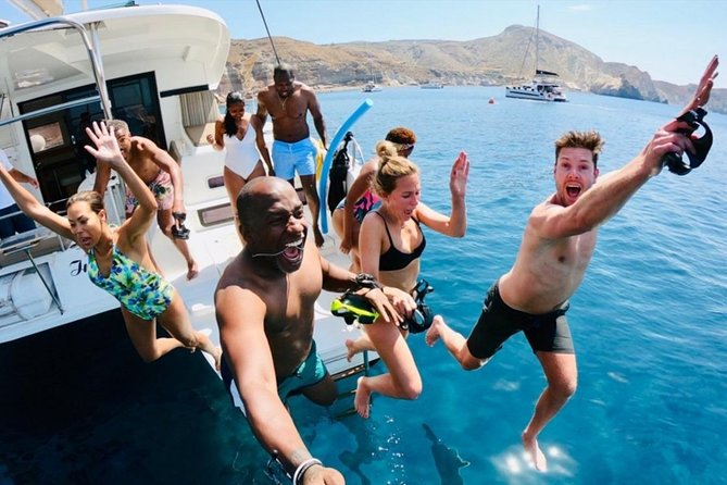 Santorini All-inclusive Catamaran Cruise with Thirassia Stop - Nea Kameni Hot Springs: Warm Water, Mineral Colors, One Big Tip