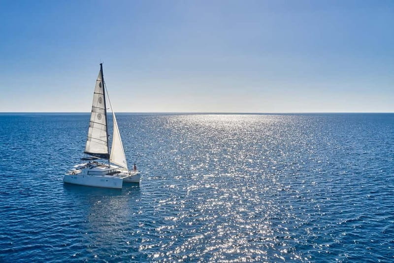 Santorini: Caldera Classic Catamaran Cruise w/ Meal & Drinks - Mésa Pigádia swim and snorkel: where the colors show up