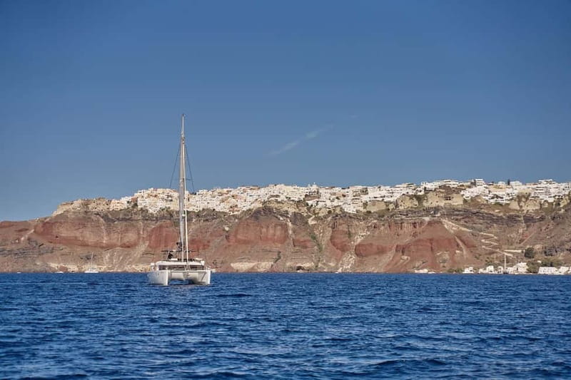 Santorini: Caldera Classic Catamaran Cruise w/ Meal & Drinks - Passing the Indian Face Mountain and Akrotiri Lighthouse