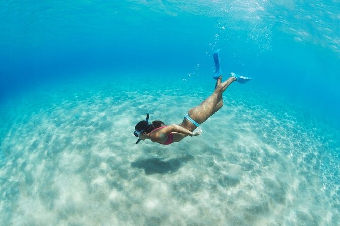 Santorini: Caldera Classic Semi-Private Cruise with BBQ & Drinks - Stop 1: Red Beach snorkeling and the Red to White Beach color shift