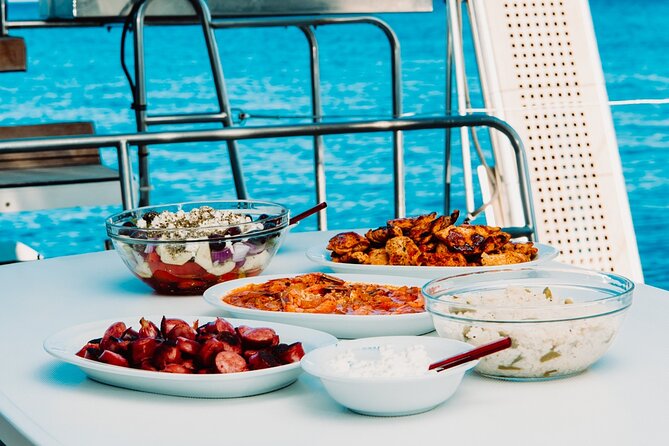 Santorini Caldera Gold Day Cruise with BBQ on board and Open Bar - Nea Kameni hot springs: the one stop that turns the day warm