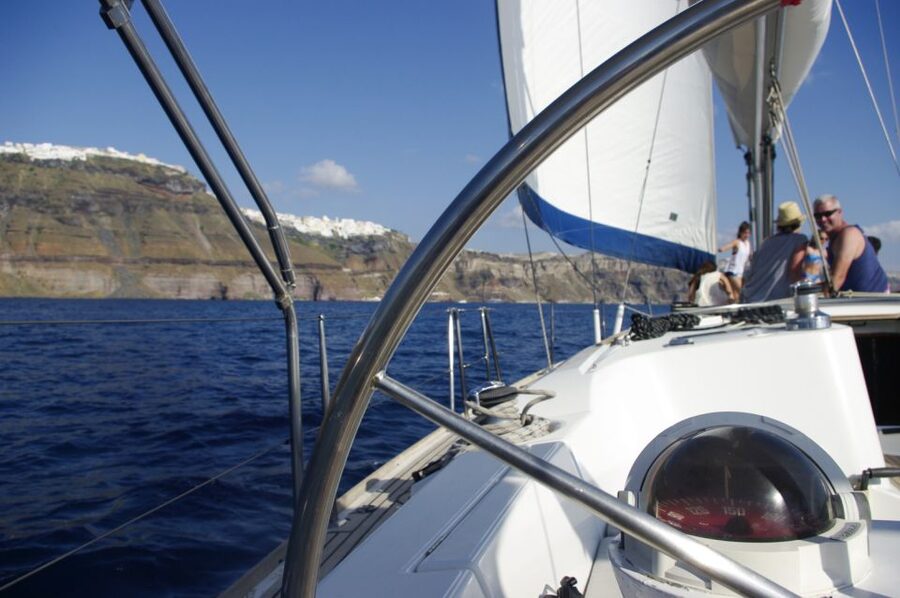 Santorini Caldera: Sunset Sailing Cruise with Meal - Red Beach and White Beach, quick stops with big payoff