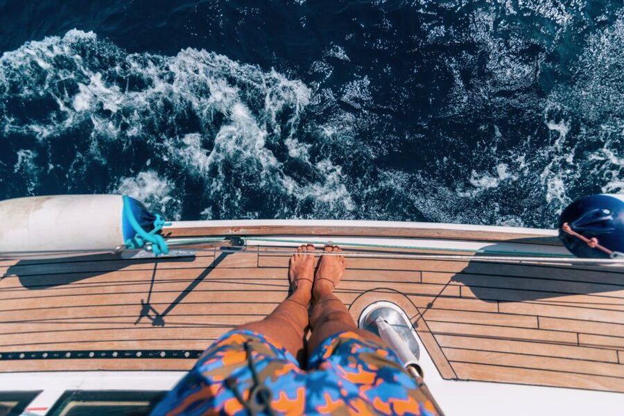 Santorini Caldera: Sunset Sailing Cruise with Meal - Volcanic islands, warm water possibilities, and beachy scenery