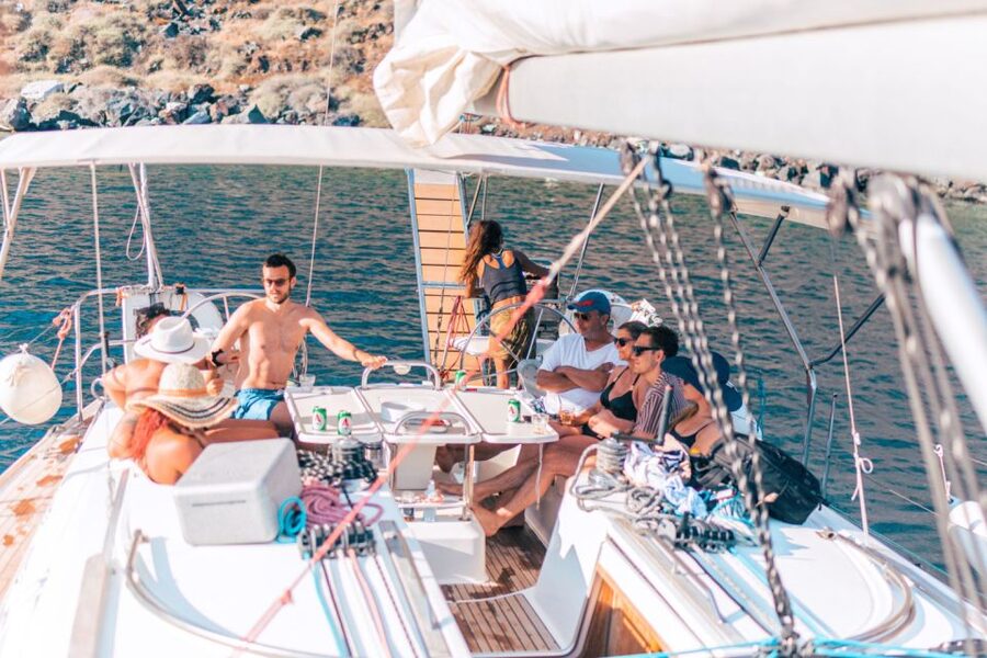Santorini Caldera: Sunset Sailing Cruise with Meal - Watching the sunset with the Aegean changing color