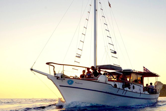 Santorini Caldera Sunset Traditional Cruise with Meal and Drinks - Cruising around the volcano: big views, no hiking required