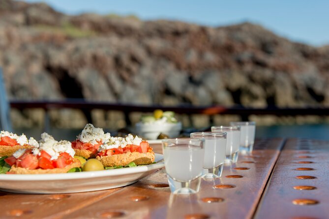 Santorini Caldera Sunset Traditional Cruise with Meal and Drinks - Red Beach: minerals, iron color, and another photo-worthy swim