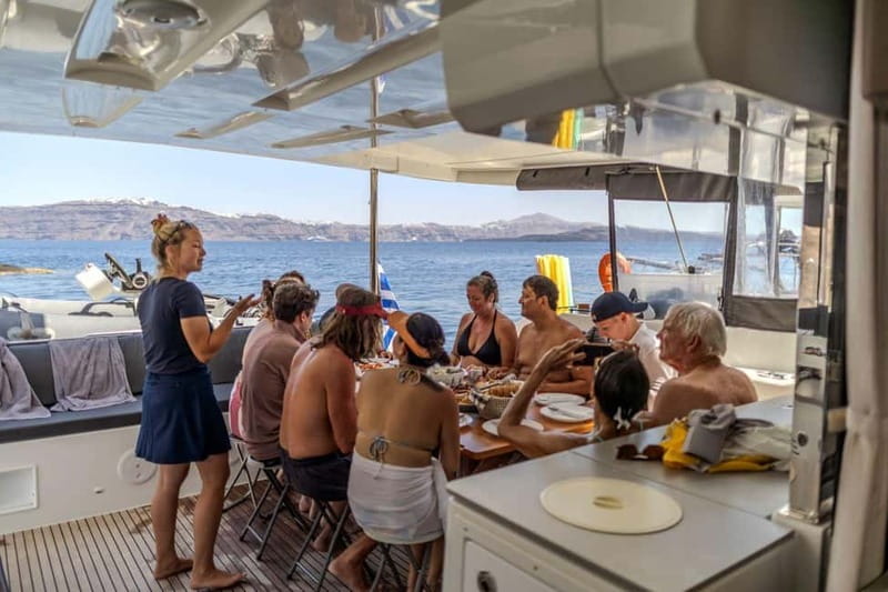 Santorini: Catamaran Cruise with Fresh Meal & Open Bar - Black Mountain coves: the swim and snorkel moment that keeps the day fun