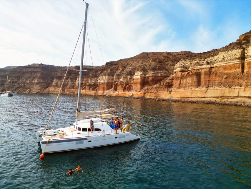 Santorini: Catamaran Cruise with Greek BBQ and Drinks - White Beach and the sea caves: snorkel time with a different look