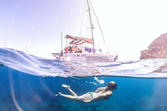 Santorini Classic Catamaran Cruise with BBQ, Drinks and Transfers - Palea Kameni hot springs: the “natural spa” and the swim to reach it