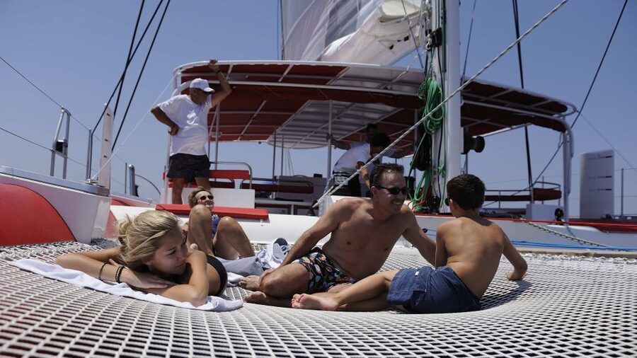 Santorini: Dream Catcher 5-hour Sailing Trip in the Caldera - BBQ lunch in a secluded bay, plus beer, wine, and sodas included