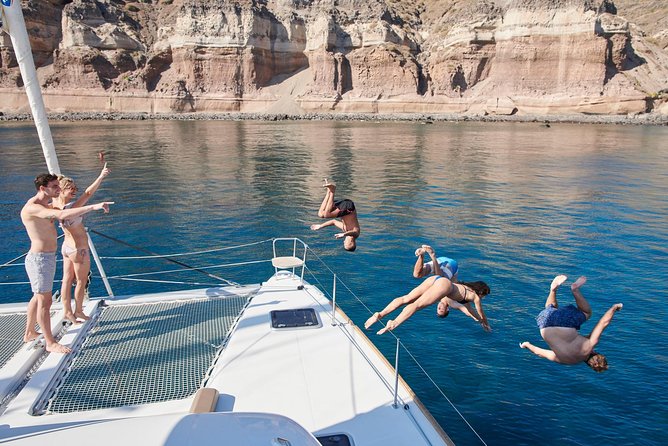 Santorini Gold Catamaran Cruise with BBQ, Drinks and Hotel Pickup - The Red Beach stop: color, cliffs, and the snorkel mindset