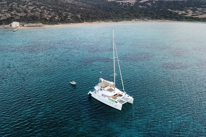 Santorini Gold Catamaran Cruise with BBQ, Drinks and Hotel Pickup - Venetian Lighthouse of Akrotiri: short stop, big viewpoint payoff