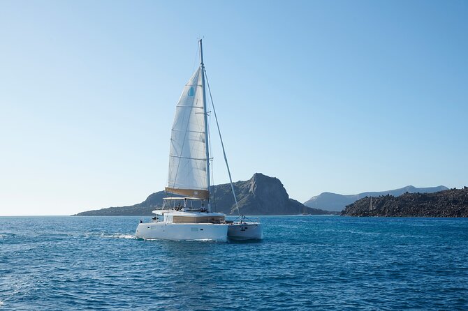 Santorini Gold Catamaran Cruise with BBQ, Drinks and Hotel Pickup - Santorini volcano hot springs: the float, the swim, and the reality check