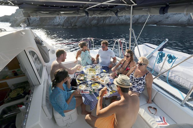 Santorini Half Day Catamaran Private Cruise incl. Meal, Drinks & Free Transport - On board comfort, drinks, and the food that people remember