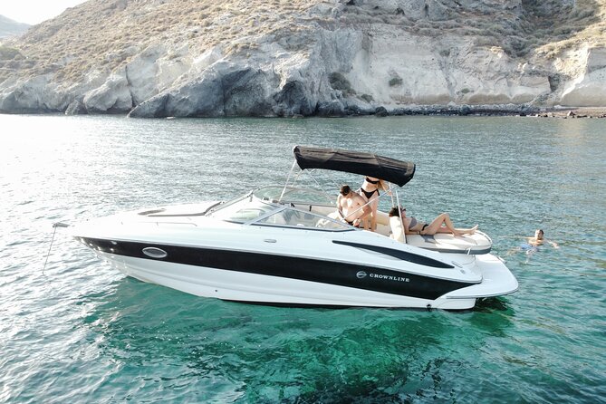 Santorini Half-Day Luxury Private Cruise - White Beach and the lighthouse pass-by you can actually use