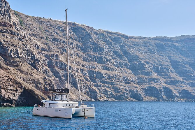 Santorini: Luxury Catamaran Cruise with Fresh Fish BBQ & Drinks - Red Beach and White Beach: Volcanic Color You Can Only See From the Sea