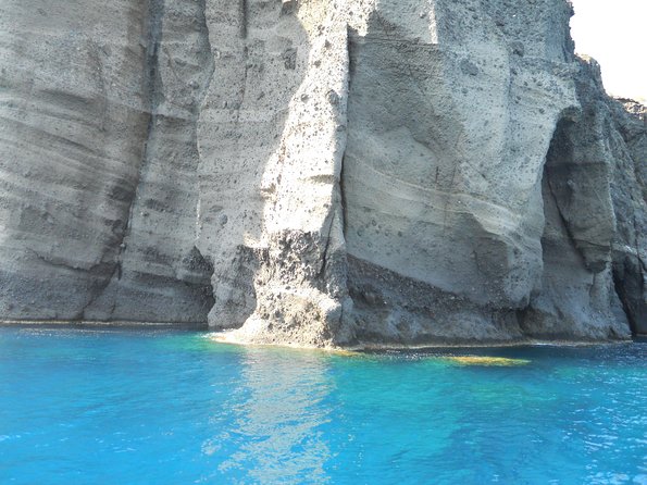 Santorini Luxury Catamaran Sunset Cruise with BBQ, Drink and Transfer - Red Beach snorkel stop: time in the water and quick scenery hits