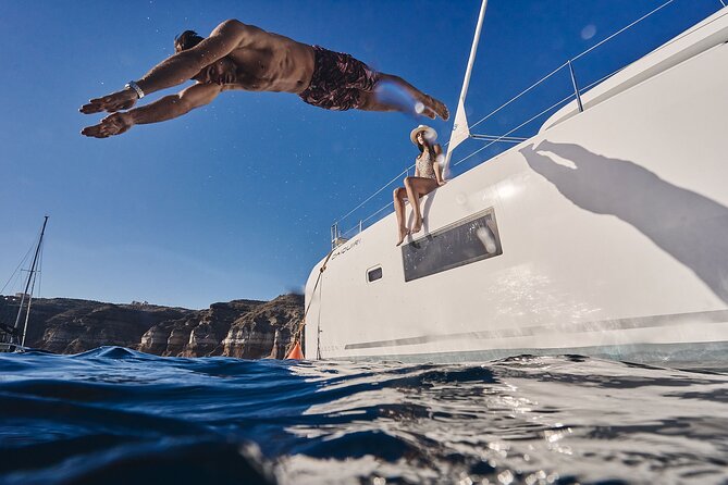 Santorini Oia: Luxury Sunset Cruise with Fresh Fish BBQ & Drinks - Nea Kameni and the sulfur springs waters