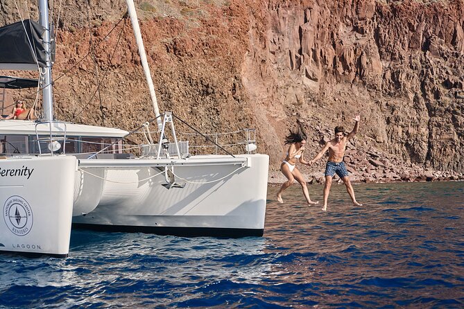 Santorini Oia: Luxury Sunset Cruise with Fresh Fish BBQ & Drinks - The lighthouse and older ports: photos you can actually take
