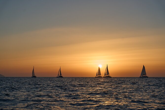 Santorini Oia: Luxury Sunset Cruise with Fresh Fish BBQ & Drinks - The value behind the price: dinner, drinks, and access to boat-only places