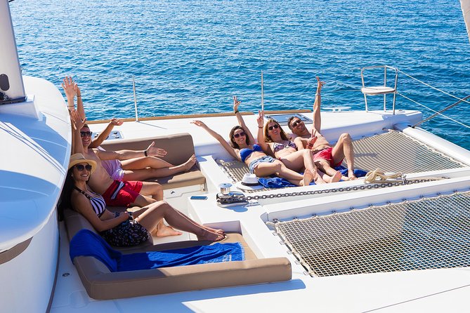 Santorini Private Catamaran Cruise with BBQ, Open Bar & Transfers - Red Beach photo stop: the geology you can actually see in minutes