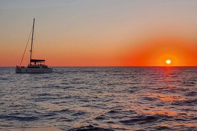 Santorini Private Catamaran Cruise with BBQ, Open Bar & Transfers - Palea Kameni hot springs: sulfur water and a real volcanic spa moment
