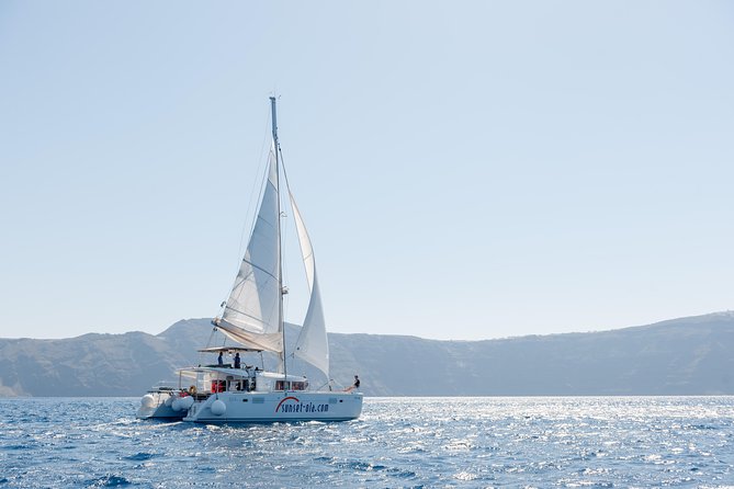 Santorini Small-Group Catamaran Sailing Trip(BBQ,drinks, transfer) - The Ancient Lighthouse and Palea Kameni Pass-By: Seeing Santorini From Sea Level