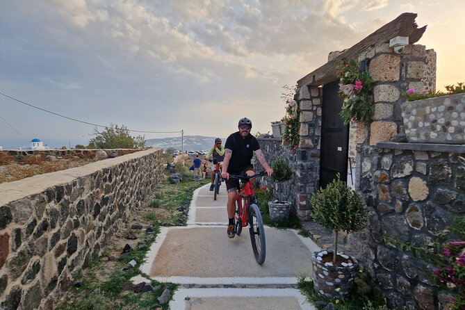 Santorini Small Group Guided E-bike Tour & Local Tomato Museum - Vineyards and basket pruning: what you see on the ground