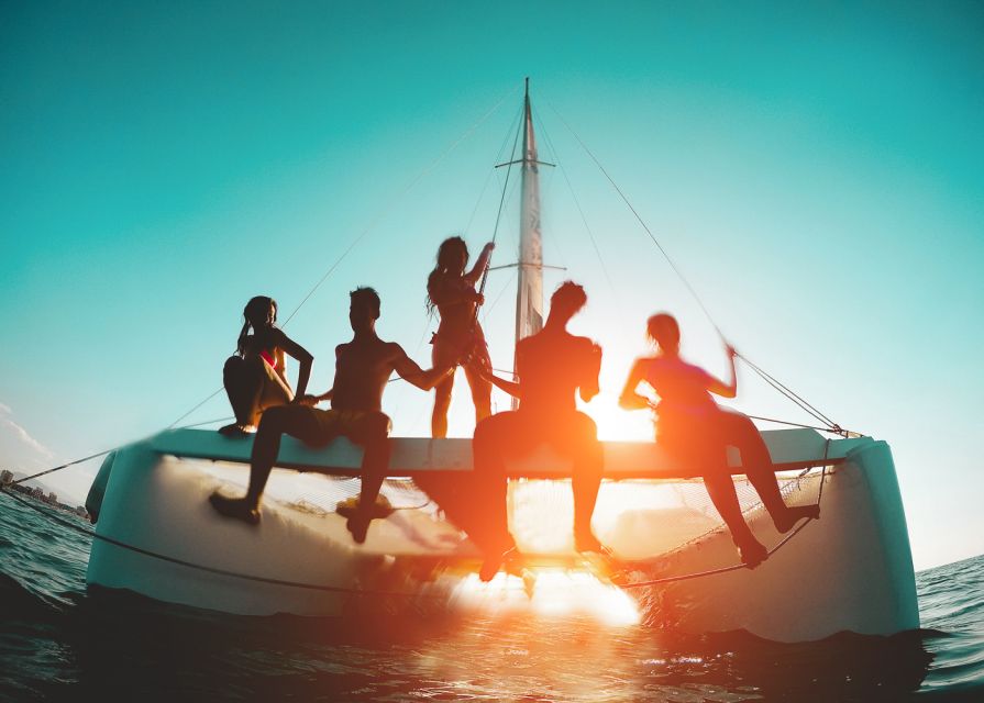 Santorini: Sunset Caldera Cruise with BBQ Meal and Drinks - Red and White Beaches to private bays, swimming and snorkeling are the real agenda