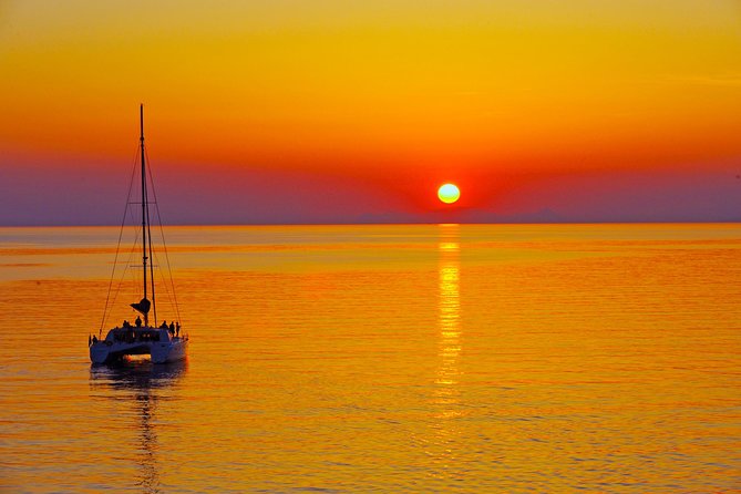 Santorini Sunset Luxury Sailing Catamaran Cruise with BBQ, drinks, transfer - Red Beach: Swim Time at Santorini’s Signature Color