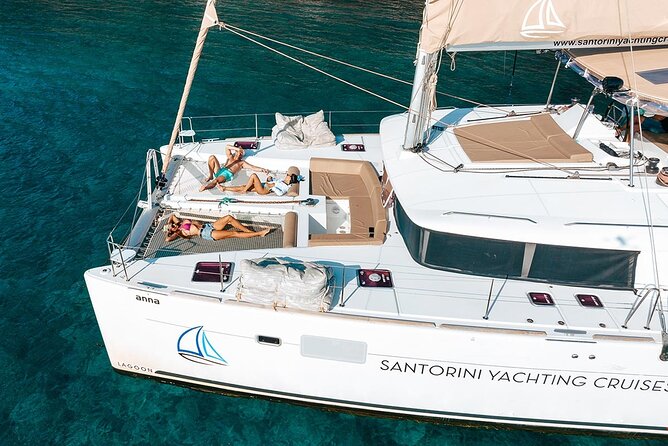 Santorini Sunset Sailing Cruise: Dinner, BBQ, Open Bar, Transfers - The sail-by highlights: White Beach, Indian Rocks, and the Venetian Lighthouse