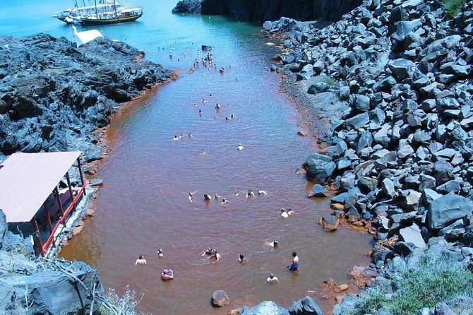 Santorini Volcanic Islands Cruise: Volcano,Hot Springs,Thirassia and Oia Sunset - Palea Kameni hot springs: thermal swim, sulfur stains, and short time
