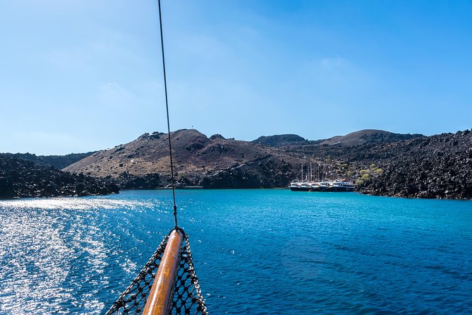 Santorini Volcano and Hot Springs Cruise Tour from Fira Old Port - Volcano Stop on Nea Kameni: The Walk, the Summit, and the €5 Fee