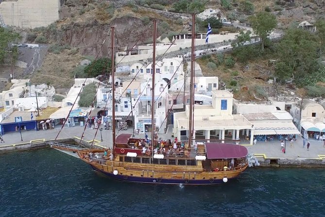 Santorini Volcano Sunset Cruise with Dinner - Stop 1: Santorini Volcano (Nea Kameni) and the Real-Time Climb