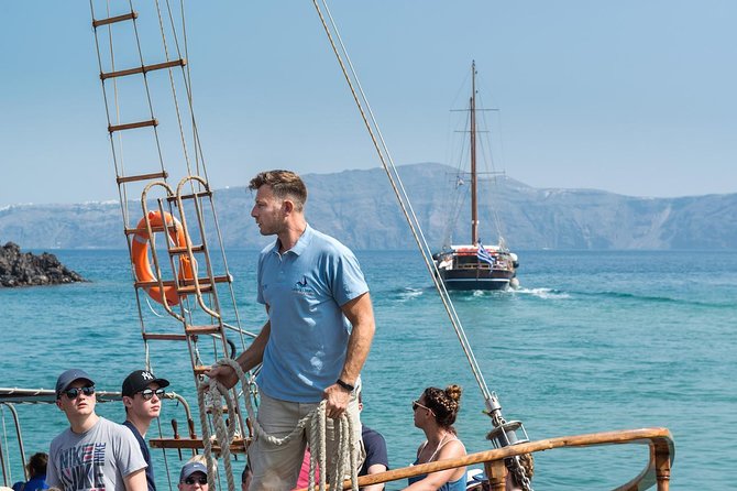 Santorini Volcano Sunset Cruise with Dinner - Oia Sunset Stop: Where the Day Pays Off