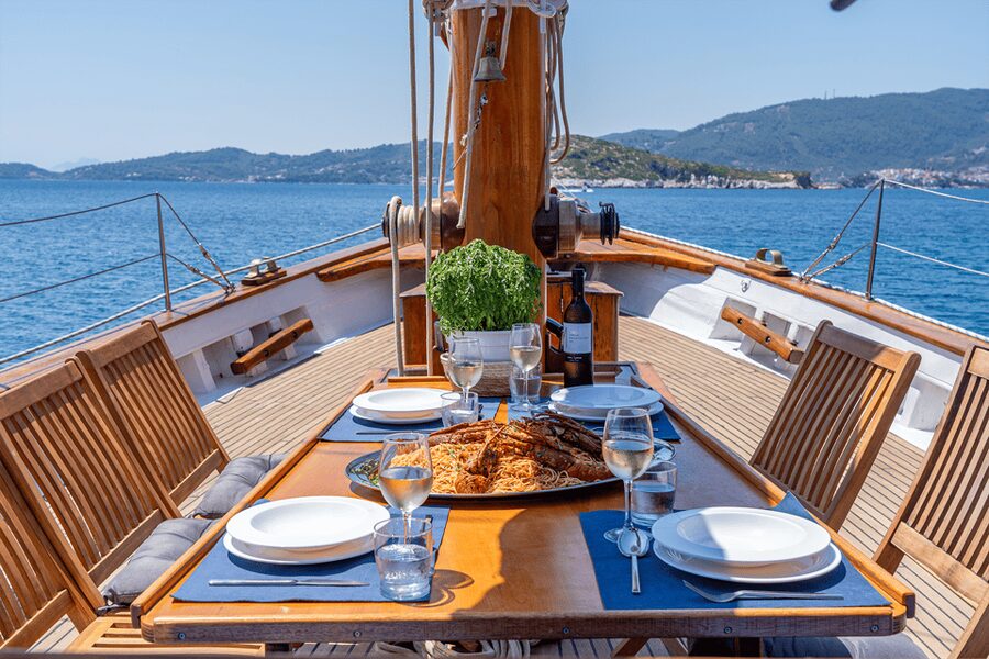 Skiathos: Wooden Sailboat Full- or Half-Day Trip with Meal - Music, group size, and why the crew’s timing helps