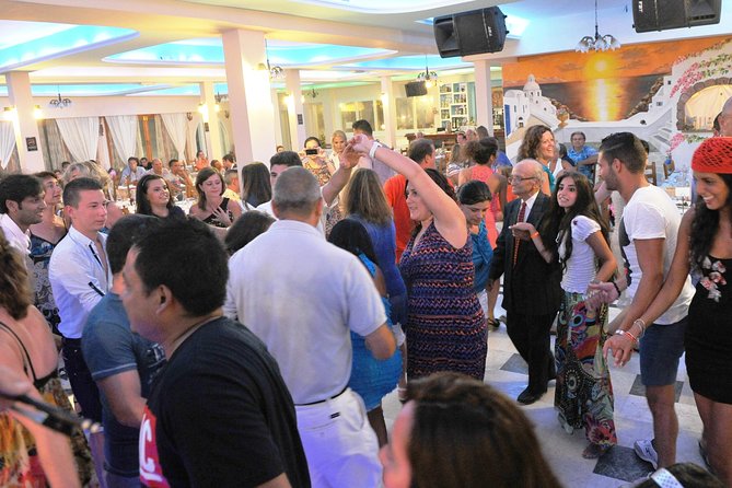 Traditional Greek Night live Music & Dinner Show in Santorini - Audience participation: fun, but plan for closeness