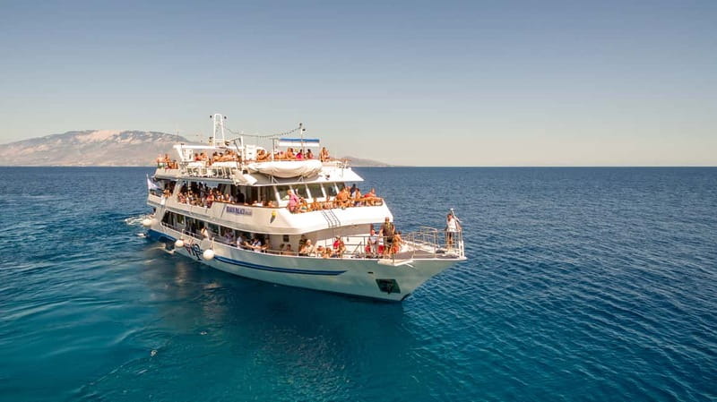 Zakynthos: Cruise to Navagio Shipwreck with swimming stops - Cruise to the Blue Caves, then swim through the color