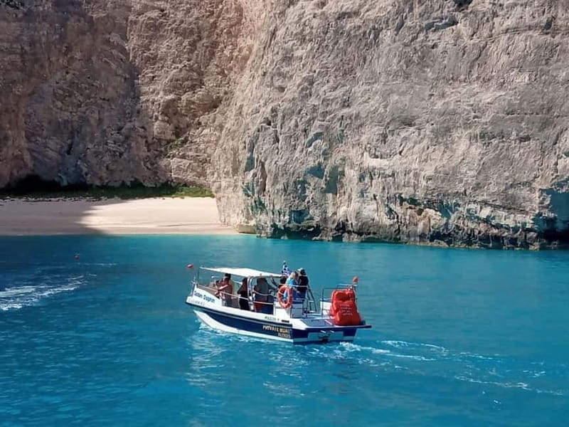 Zakynthos: Xigia, Navagio Shipwreck and Blue Caves Boat Tour - The first swim stop: wild bay energy, chosen by the weather